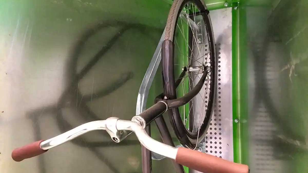 Vertical bike locker with wheel rack
