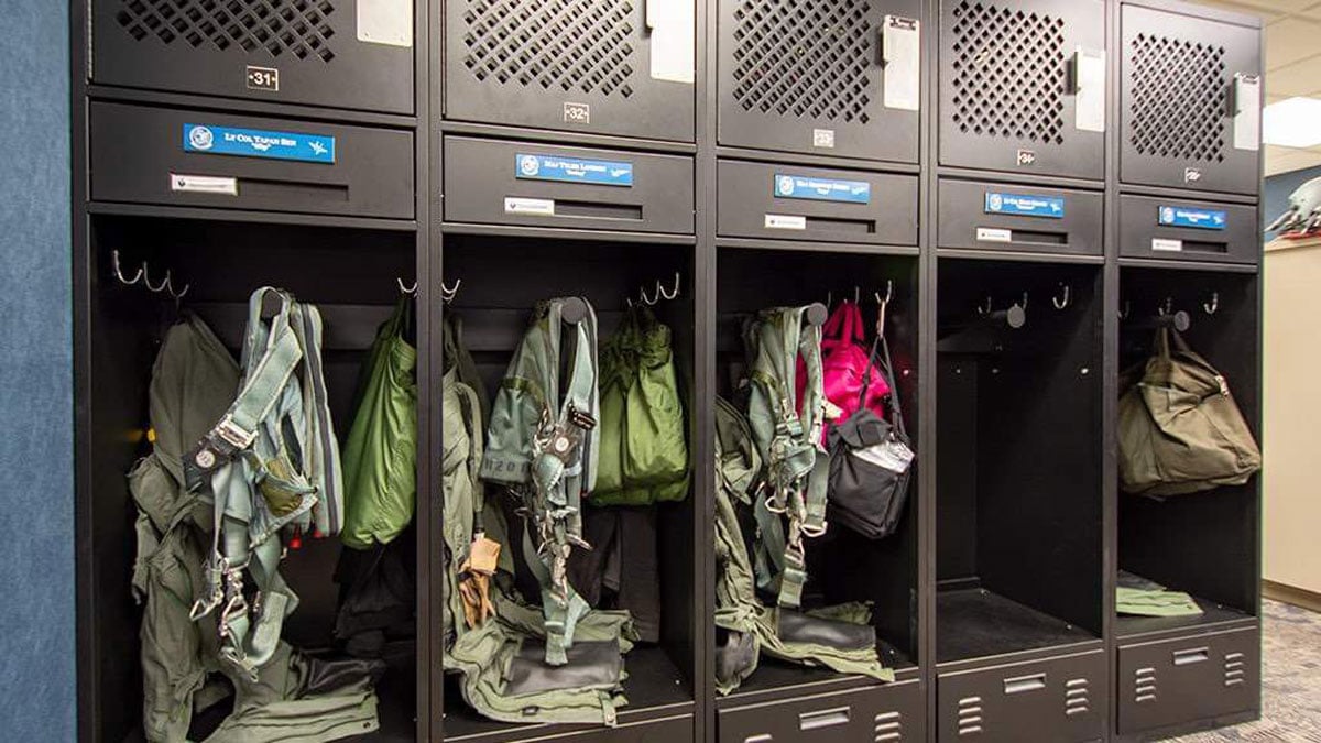 Air Force pilot lockers for helmet and flight suit storage with personalized compartments