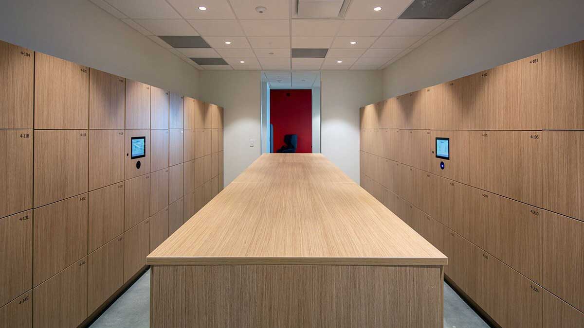 Smart keyless programmable lockers with dual touchscreens in minimalist office setting