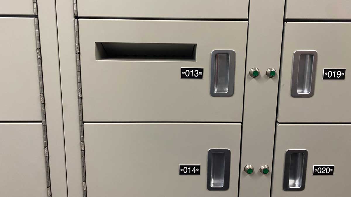 Evidence locker with secure drop slot
