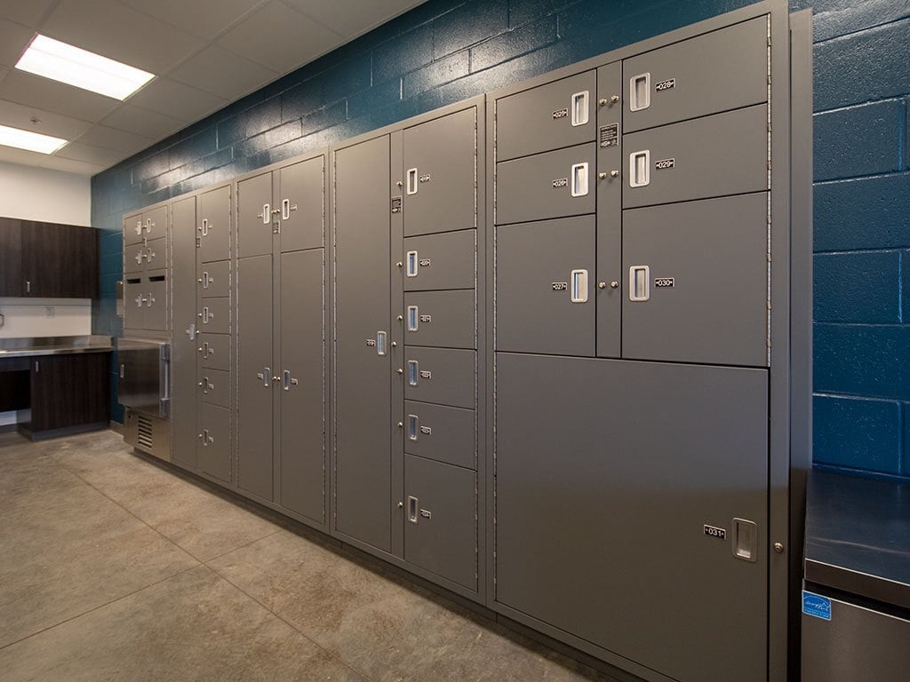 Gray pass-through evidence lockers for secure transfer between departments in police station