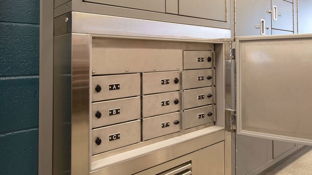 Stainless steel refrigerated evidence lockers with labeled cold storage compartments
