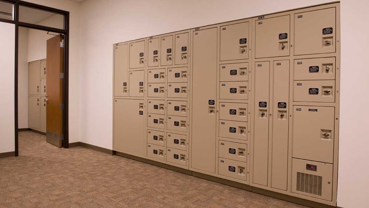 Secure evidence lockers in law enforcement storage room with multiple compartment sizes