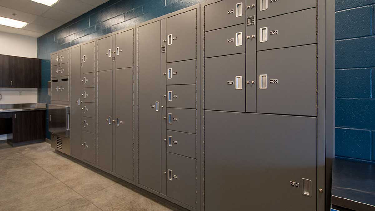 Keyless temporary evidence lockers with secure storage compartments in evidence processing room