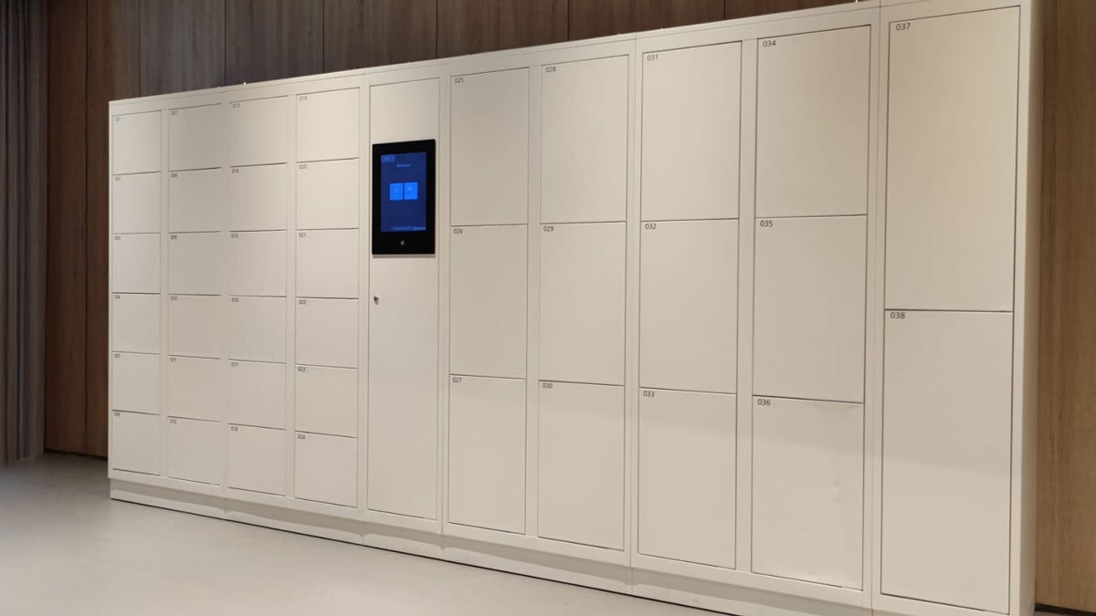 smart package lockers with touchscreen access panel for secure delivery and retrieval in modern interior setting
