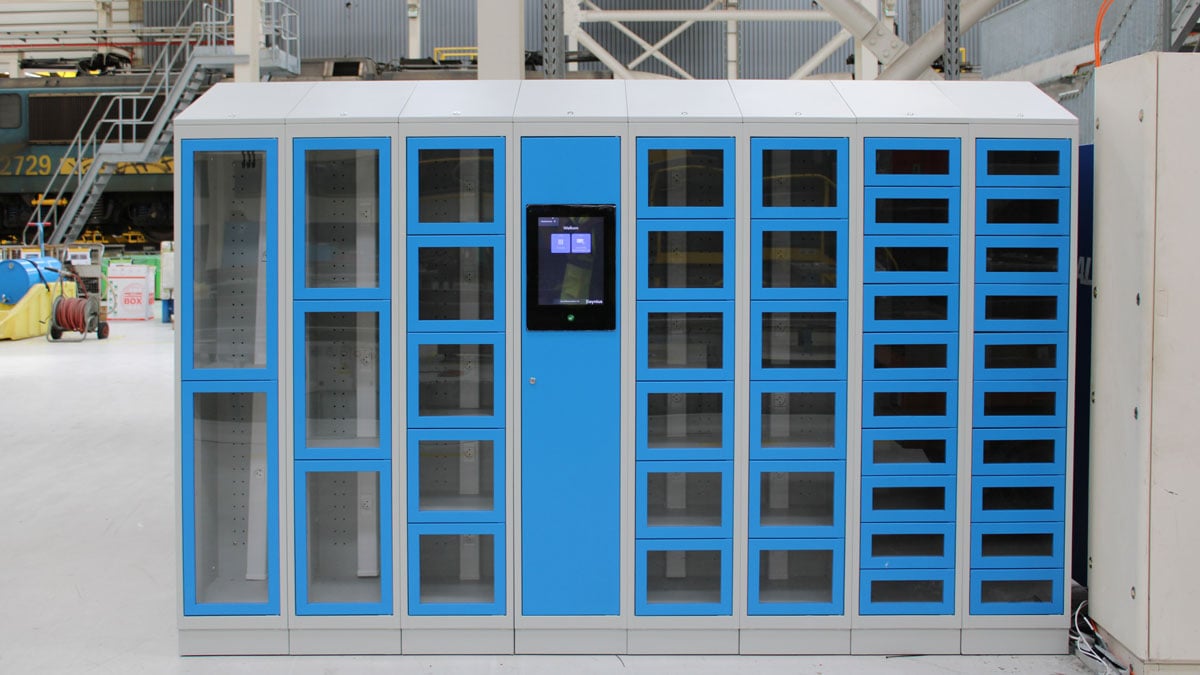 industrial smart locker system with blue and white modular compartments and touchscreen access