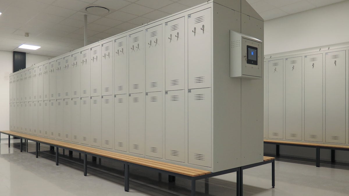 modern locker room with metal lockers and integrated smart access panel
