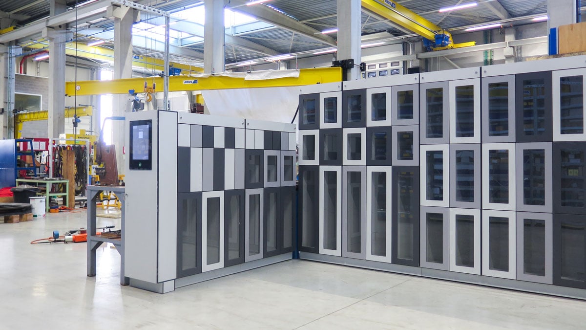 modular gray smart vending lockers with touchscreen access in a warehouse environment