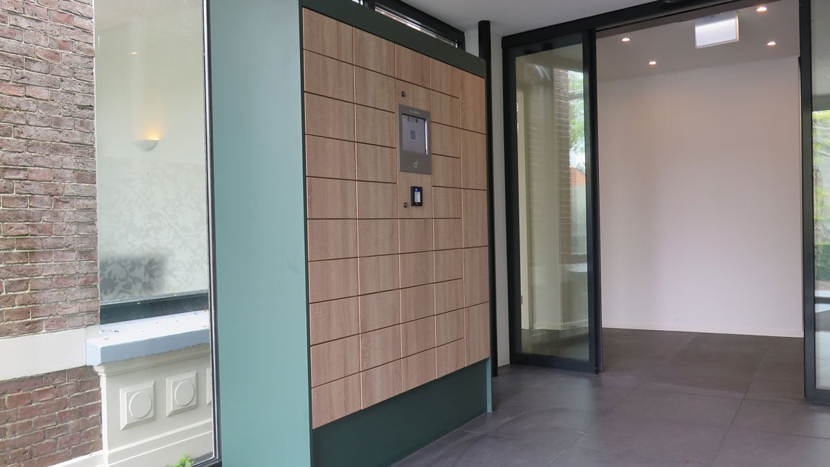 click and collect smart lockers with wood panel design in modern building interior