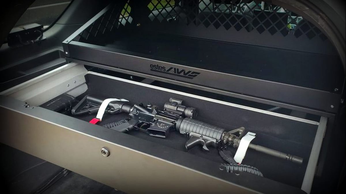 suv trunk gun safe installed behind rear seats for secure storage