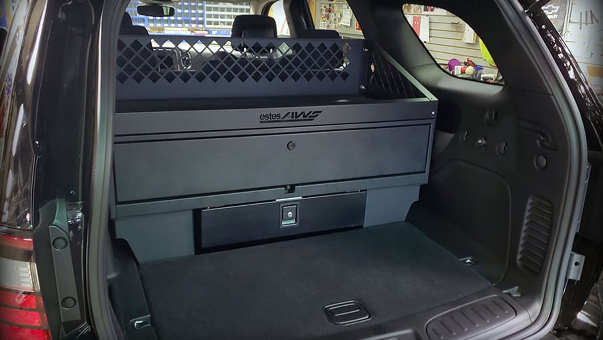 police vehicle gun storage system with mounted rifle rack