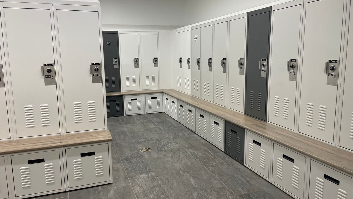 Police station locker room with durable steel gear lockers for officers