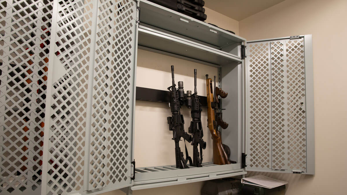 Military gun cabinet providing secure firearm organization and protection