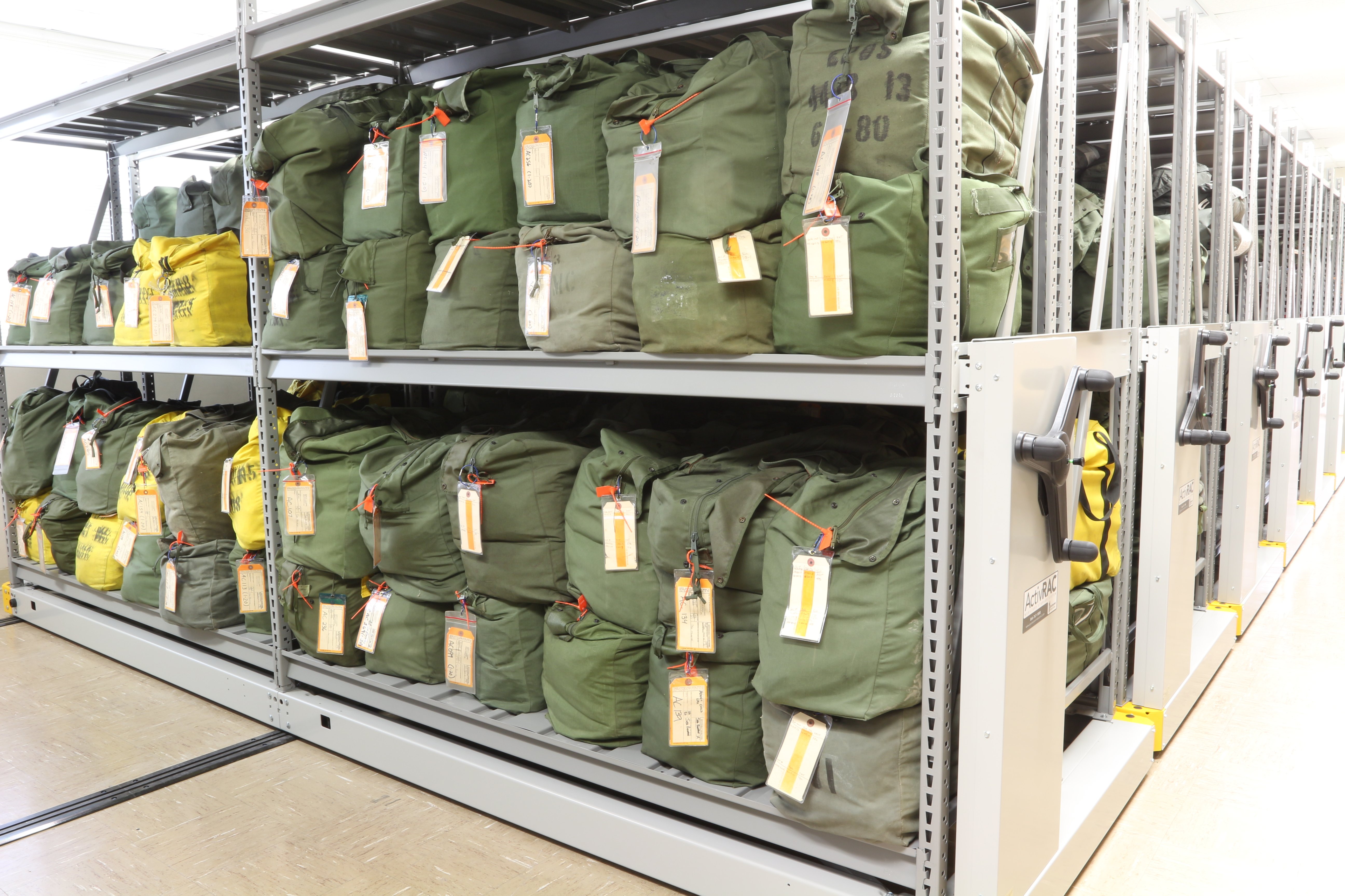 Bulk gear bag storage shelving for tagged inventory organization