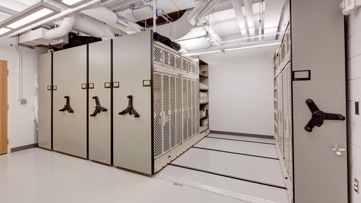 Surplus military weapons racks for efficient rifle storage and gear organization