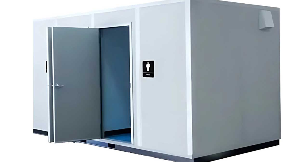open restroom pod entrance door showing interior threshold and flooring
