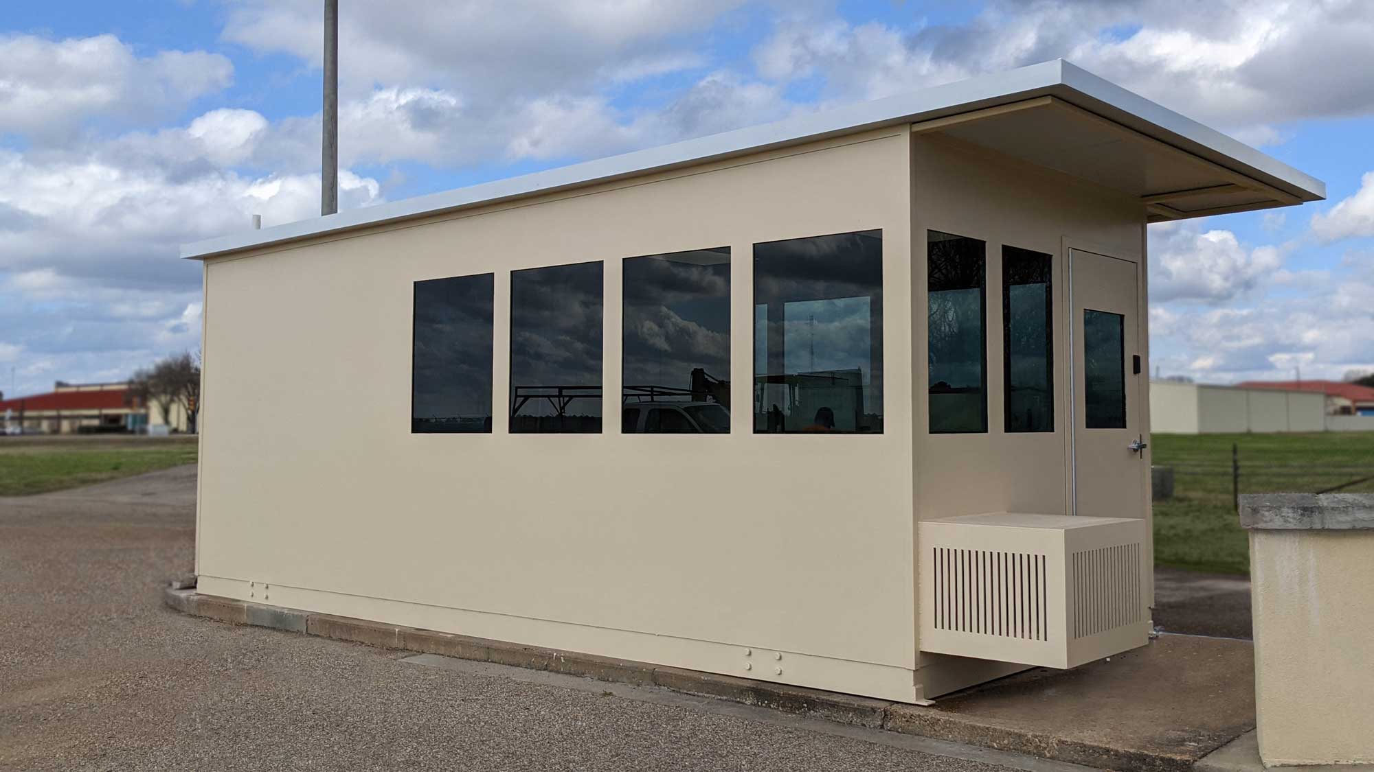 drive-thru security booth with integrated air conditioning enclosure for continuous guard comfort and monitoring