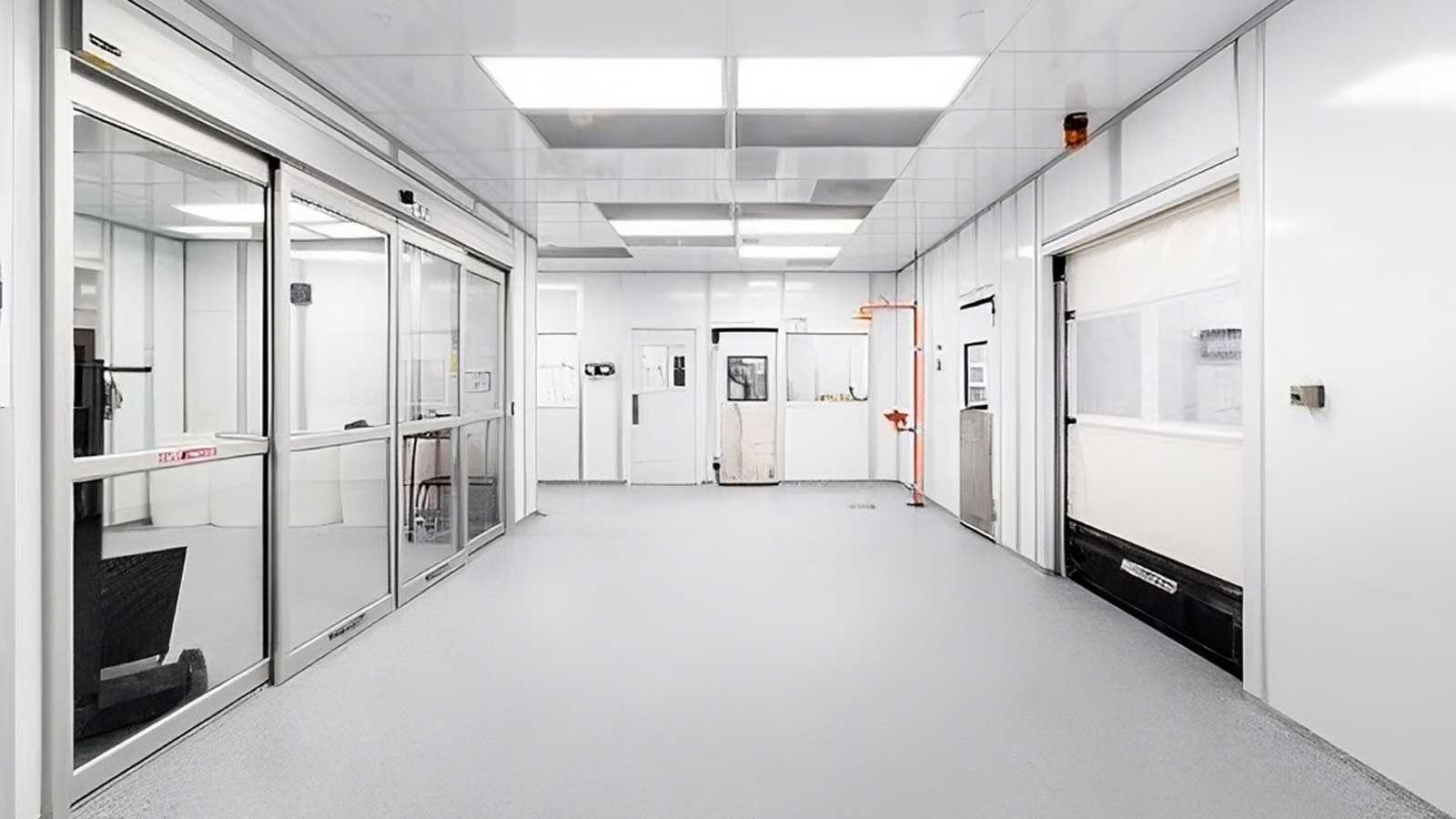 interior view comparing cleanroom and controlled environment wall panels, ceiling grid, and lighting setup