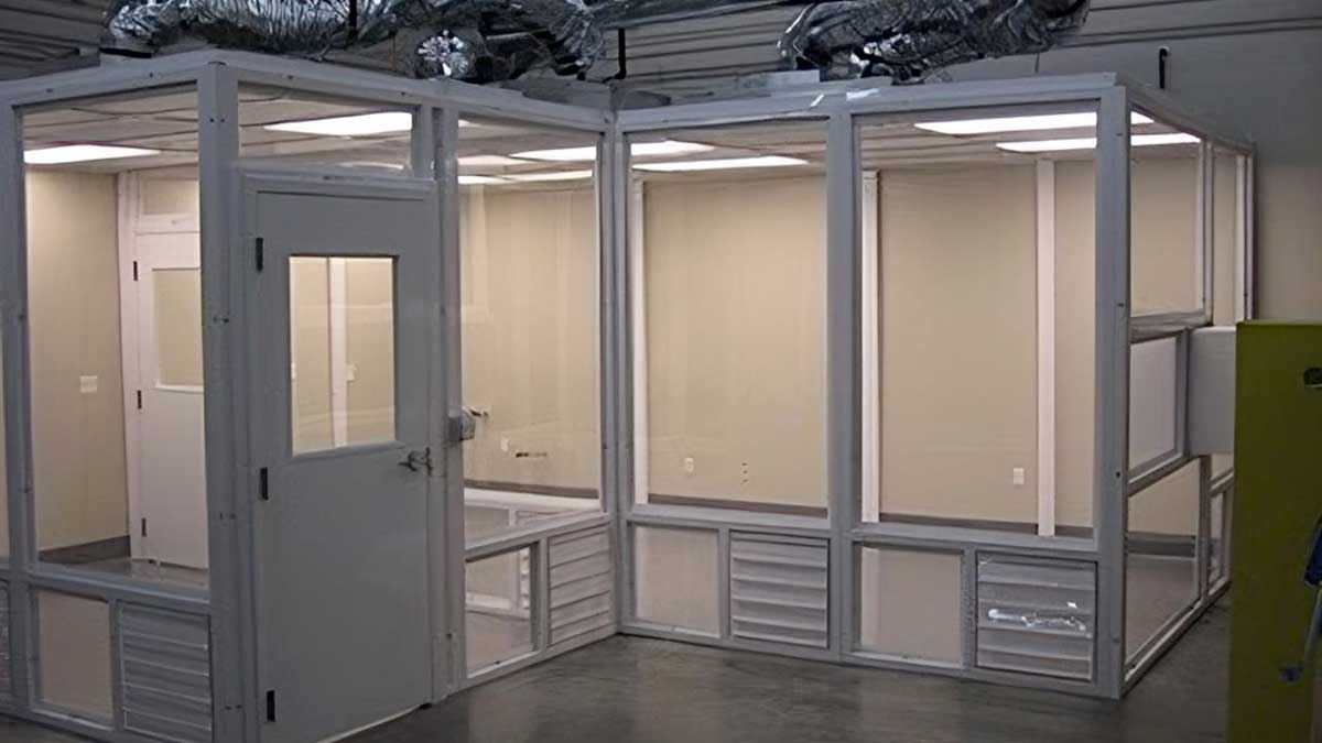 small modular cleanroom enclosure with framed windows and integrated ventilation louvers