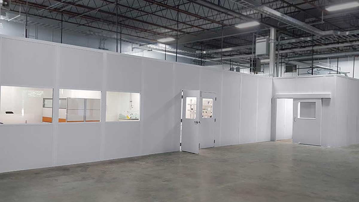Modular mezzanine inplant office providing elevated work area with staircase access