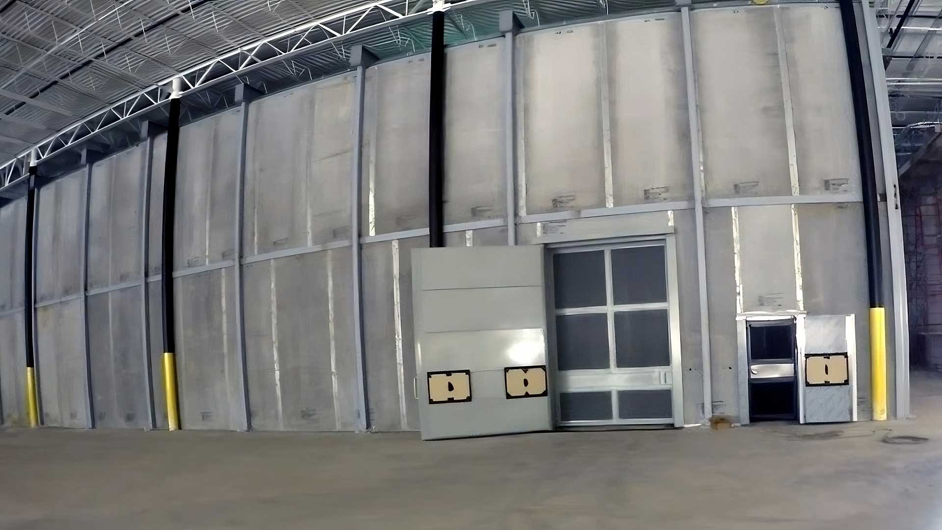 installation of modular security vault wall panels in warehouse for protected storage