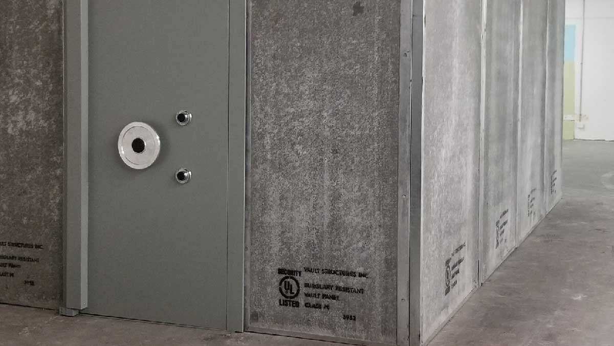 security vault panel with integrated door section assembled to form burglar-resistant enclosure