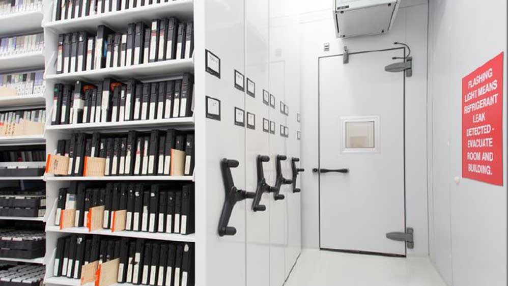 museum archival modular vault room with mobile shelving for film and document storage