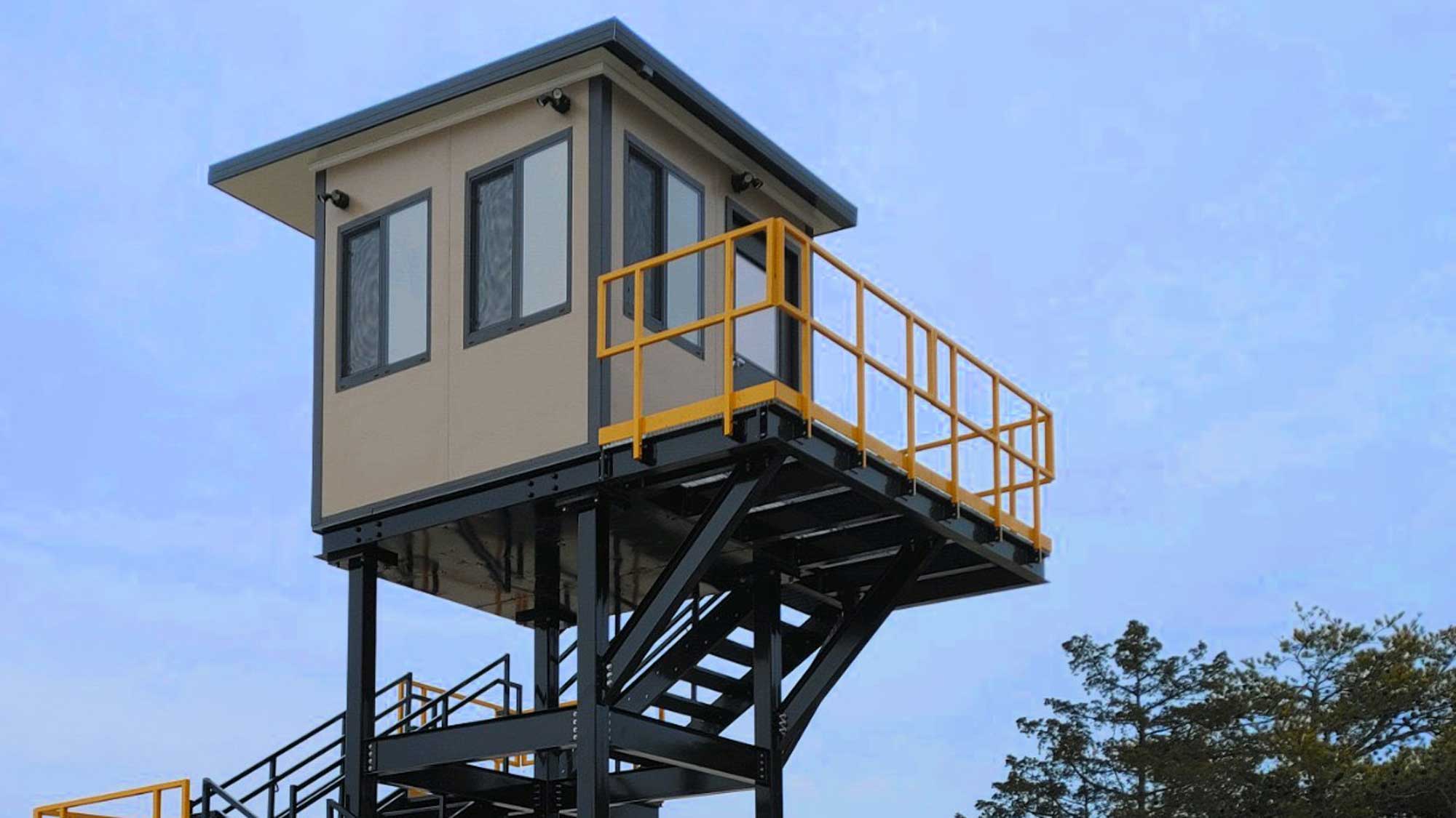 guard tower on elevated platform with safety railing and stairs for improved site monitoring