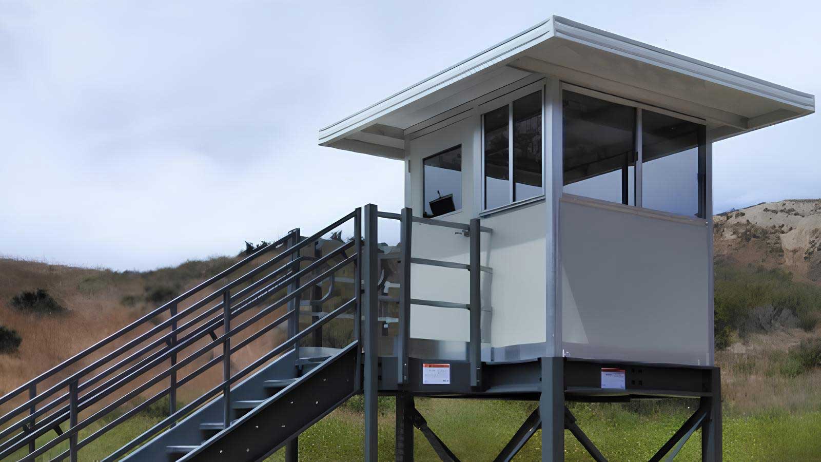portable platform observation tower with fixed stairs and enclosed cabin for elevated site observation