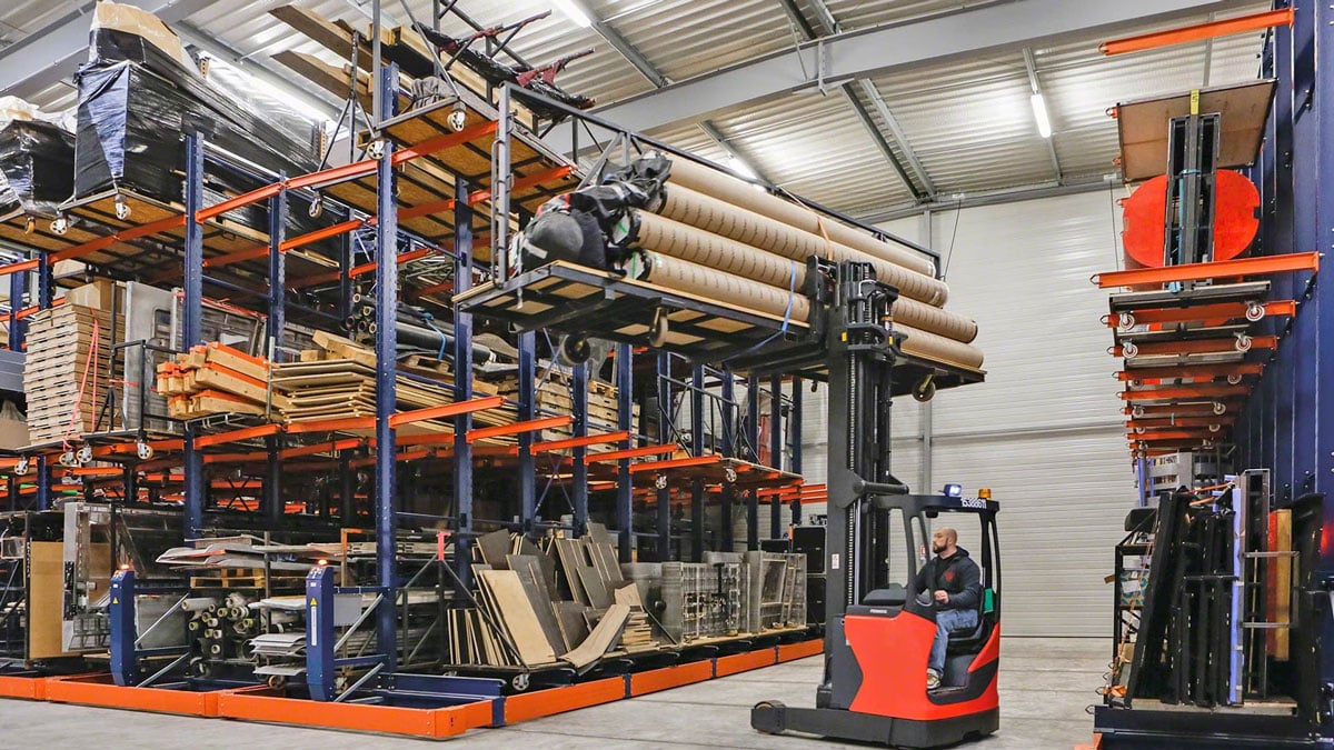 Mobile cantilever racks in a warehouse to allow for flexible and compact storage of large items