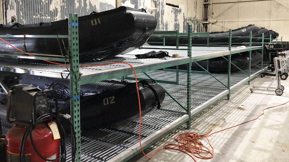  Inflatable boats stored on gravity flow racks in a military base for organized and safe storage