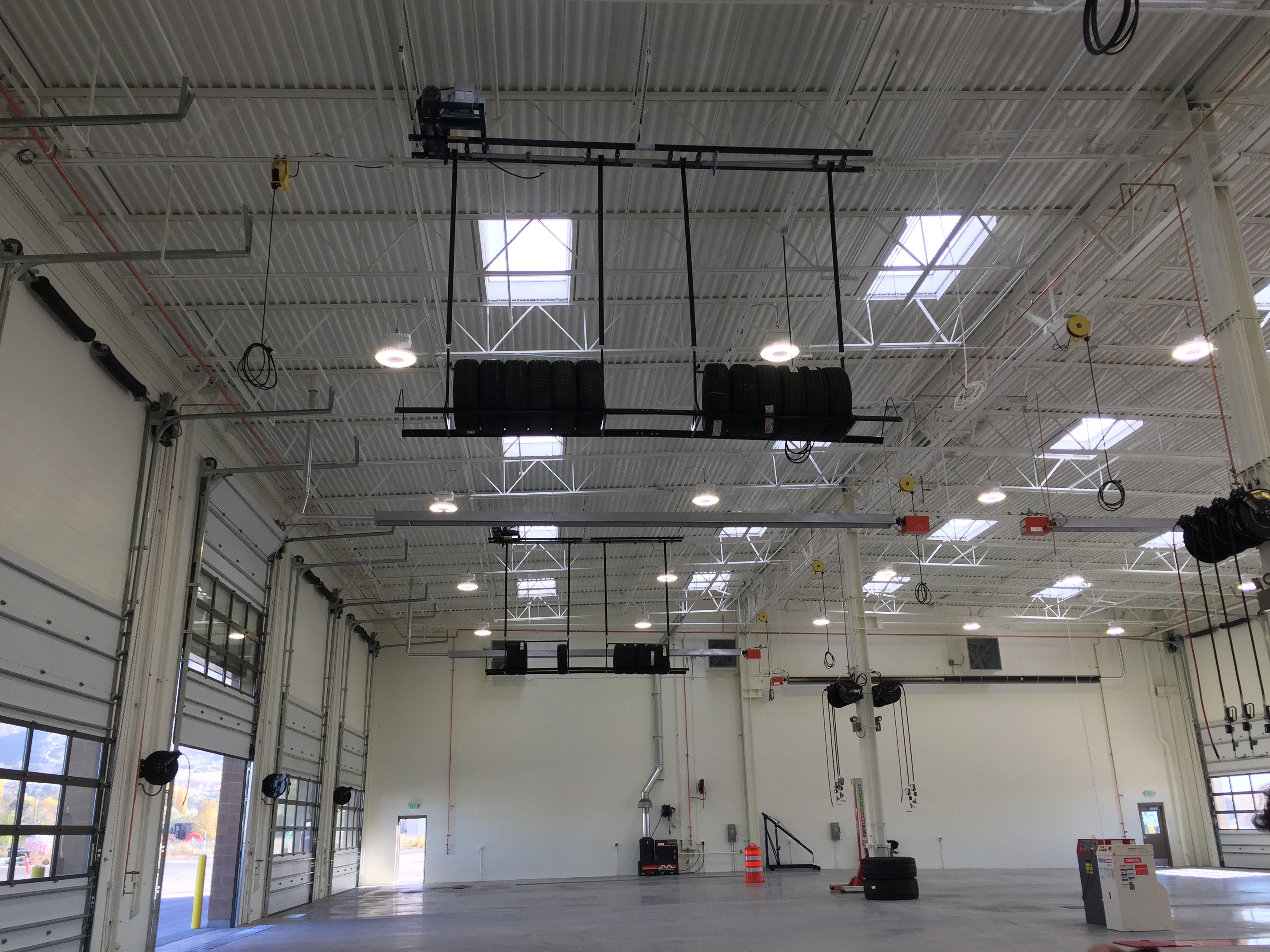 overhead storage racks installed in an automotive warehouse for tire storage
