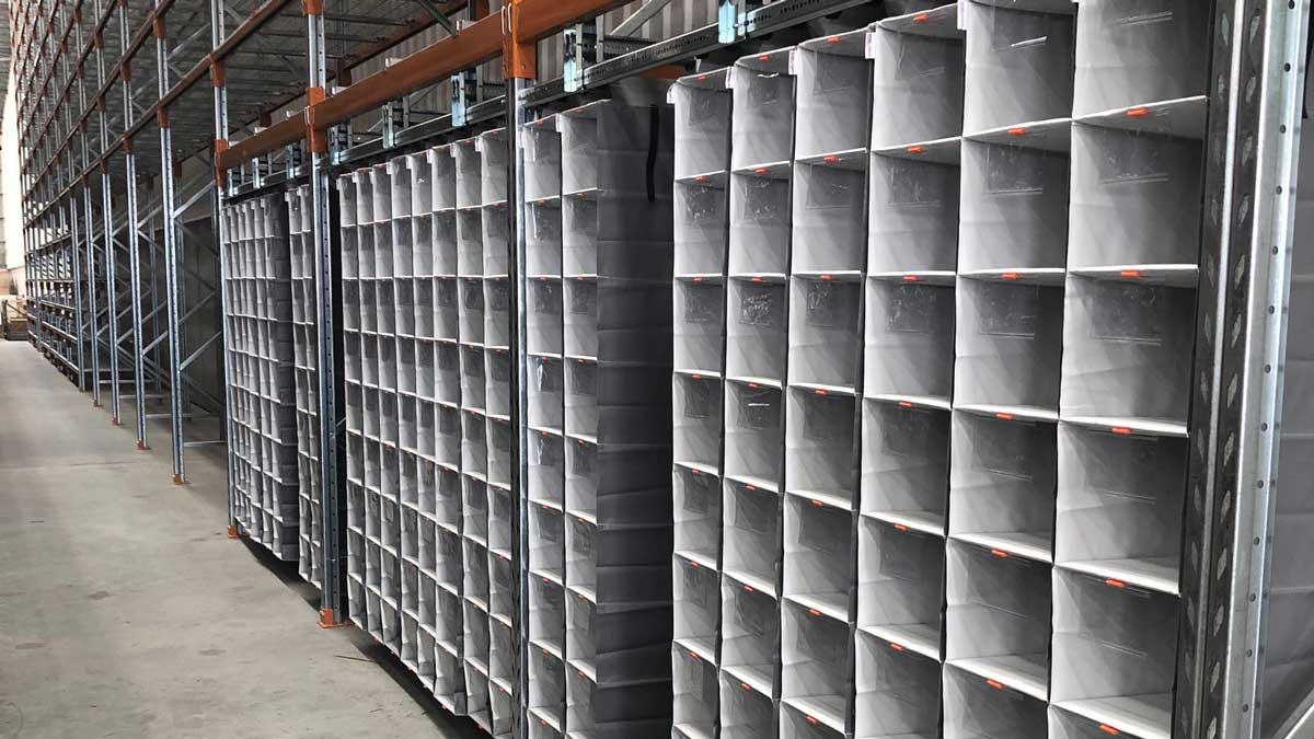 high-density bin storage system in warehouse for optimized space and organized item handling