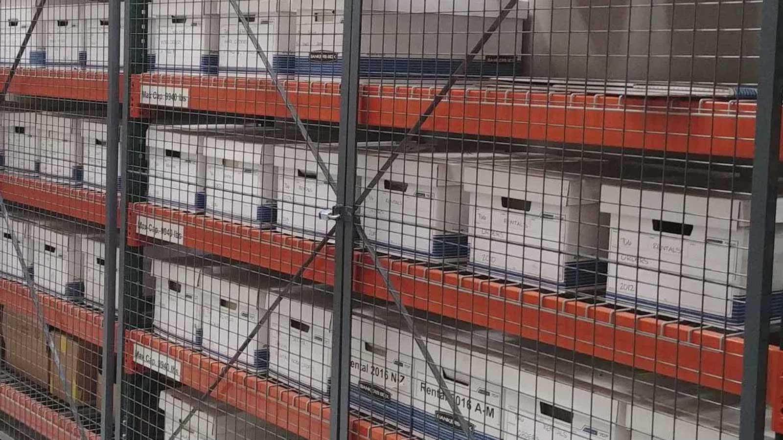 mesh enclosure doors fitted to rack frames for secure storage of archive boxes