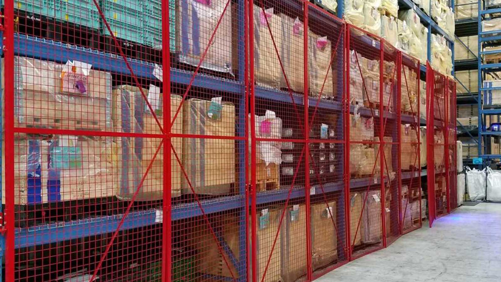 mesh enclosure panels installed on pallet rack to secure stored boxes