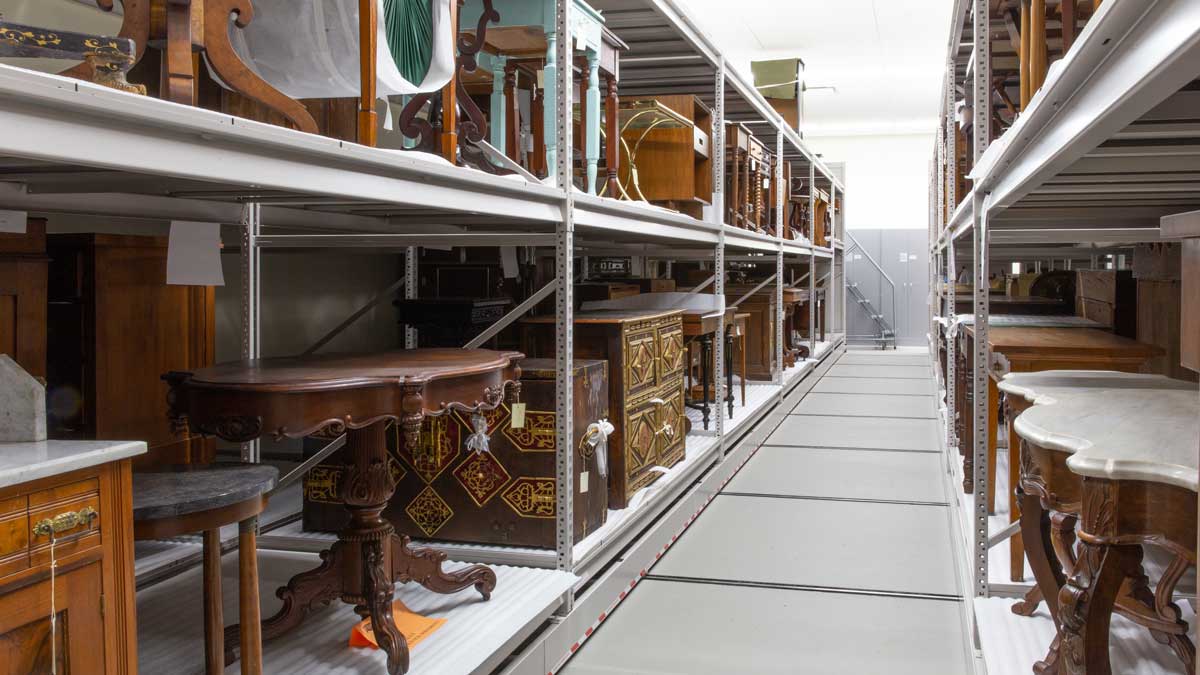 wide span shelving for storing historic furniture in a compact, organized museum collection space
