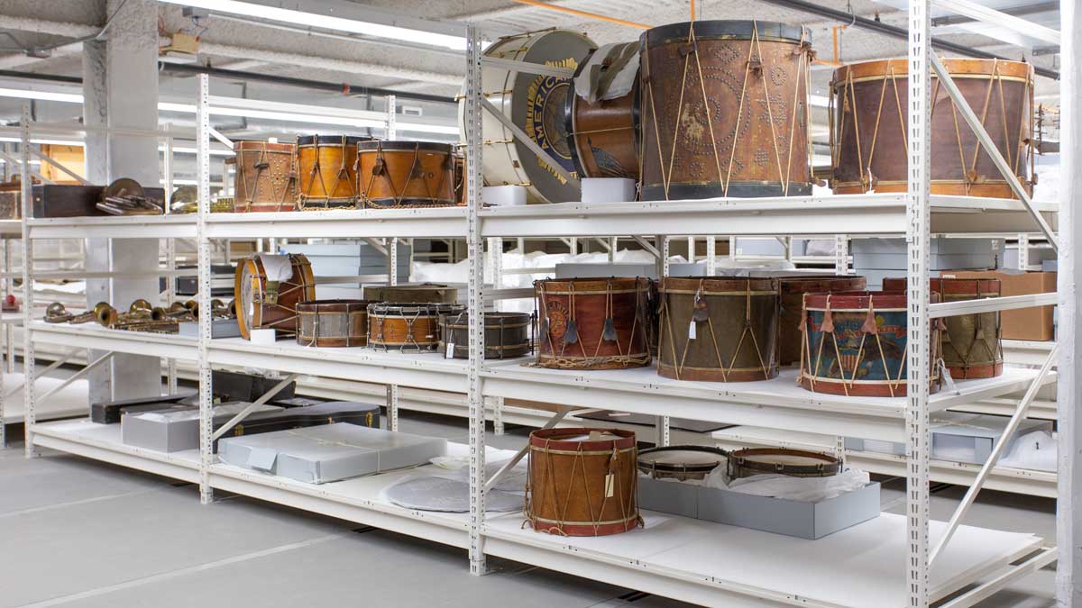wide span shelving storing a collection of museum drums in an organized and accessible layout
