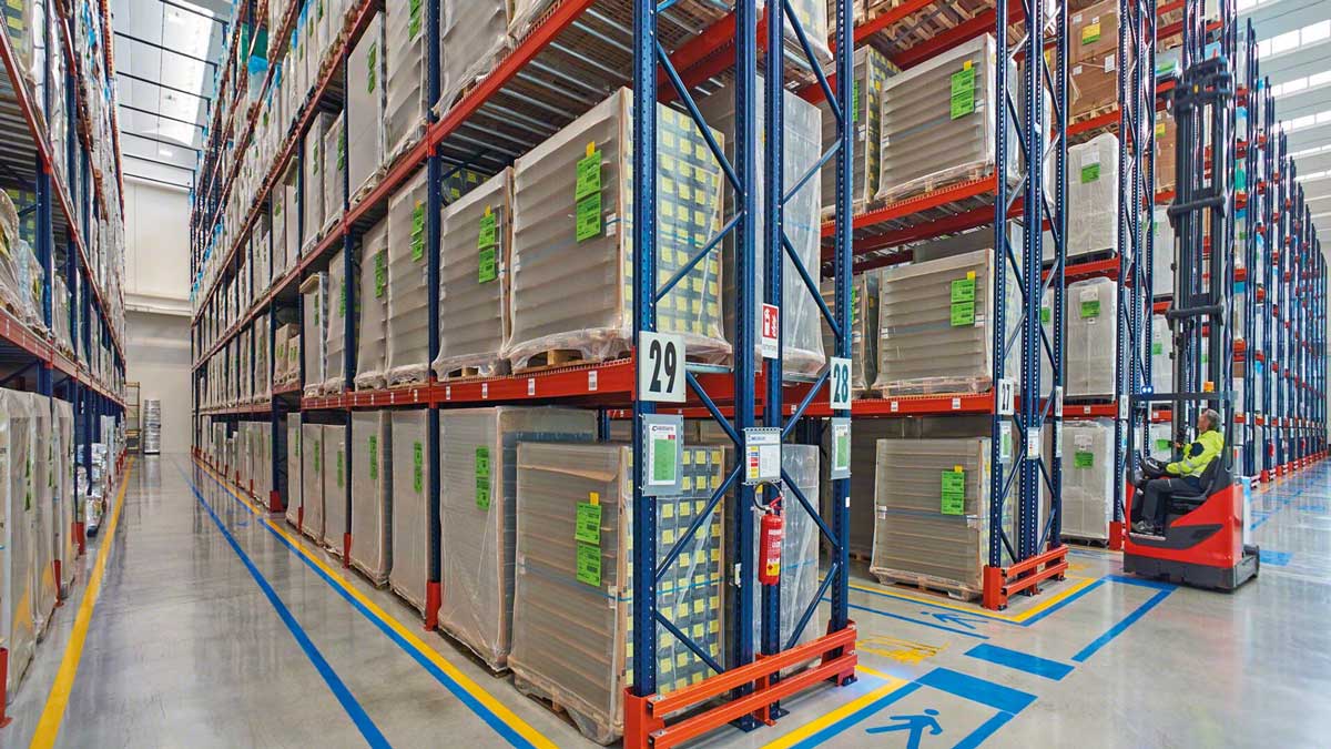 industrial metal pallet racks with floor markings outlining aisles for safe material handling