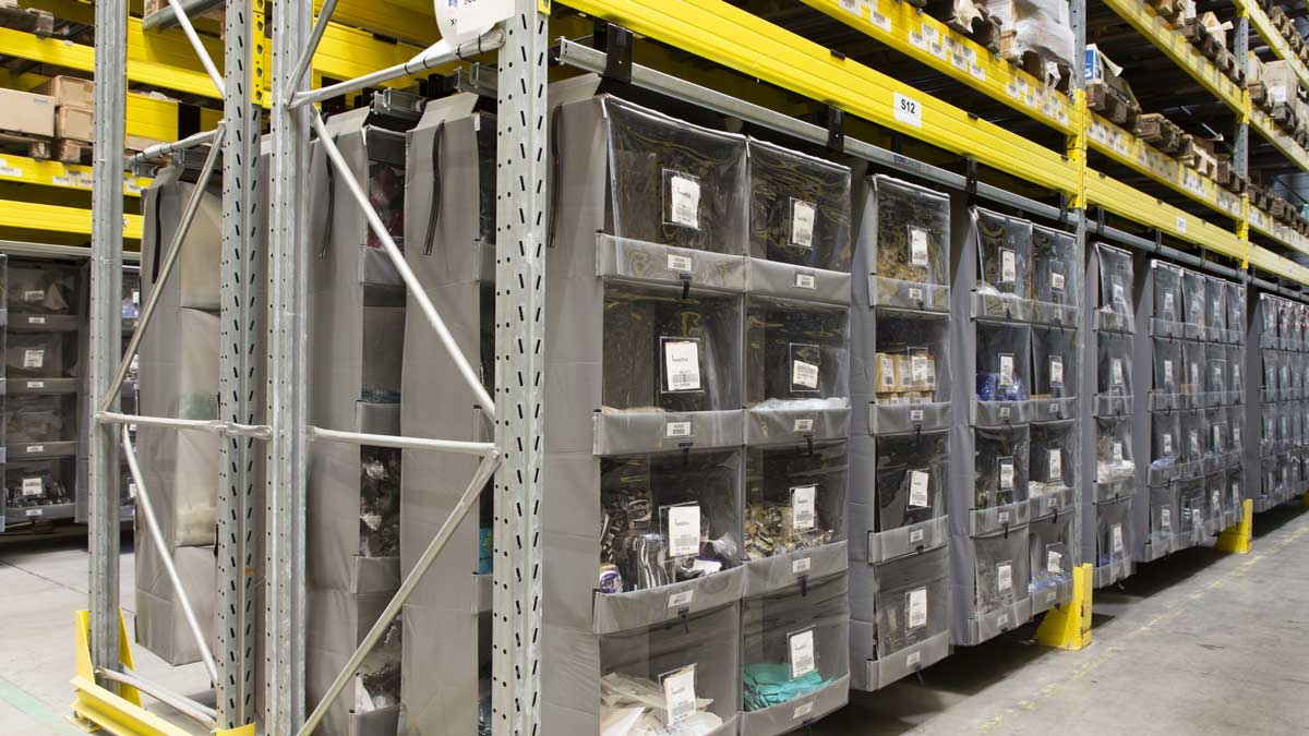 vertical bin shelving in warehouse for organized storage and fast item retrieval