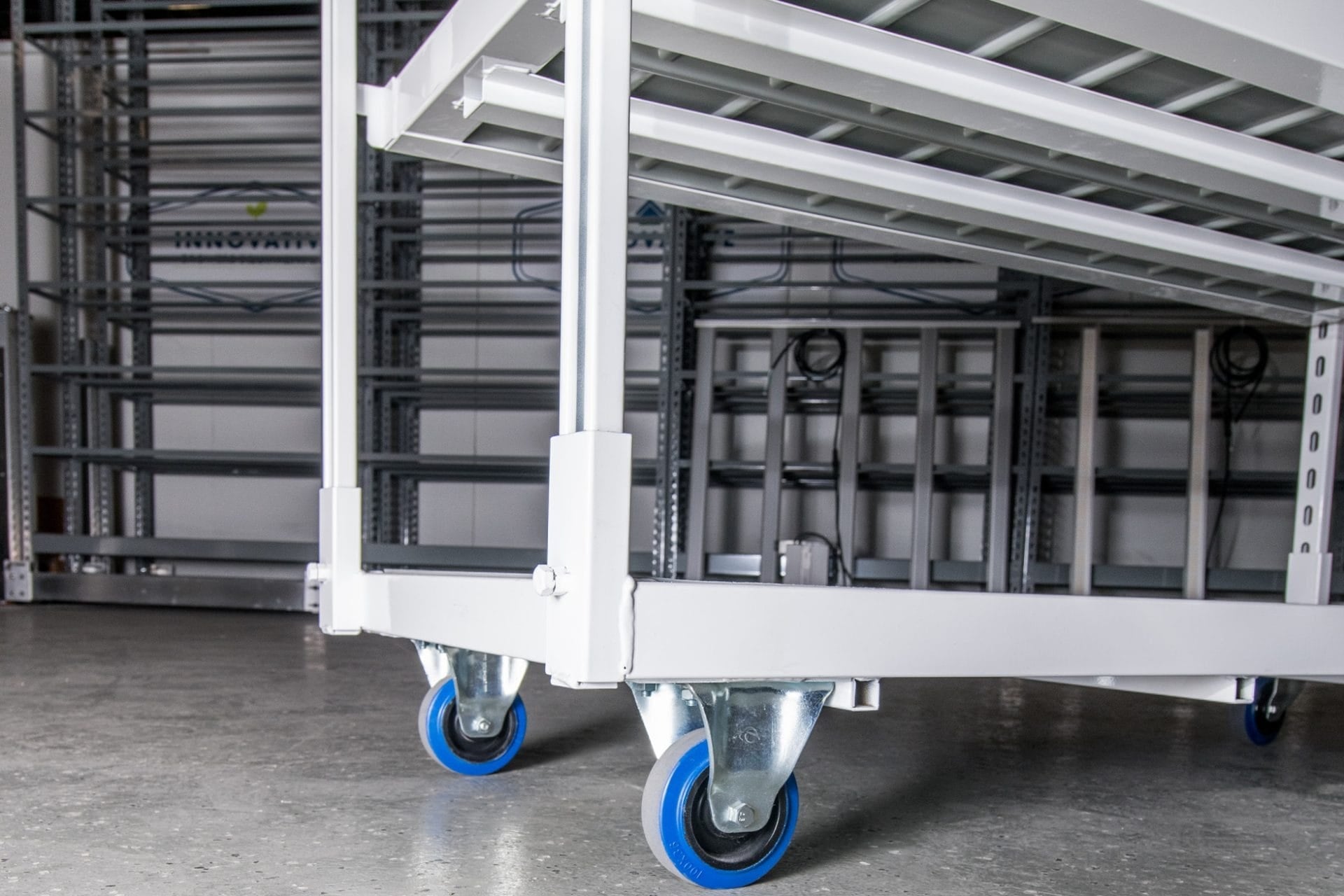rolling propagation cart caster detail for moving plant trays in a nursery