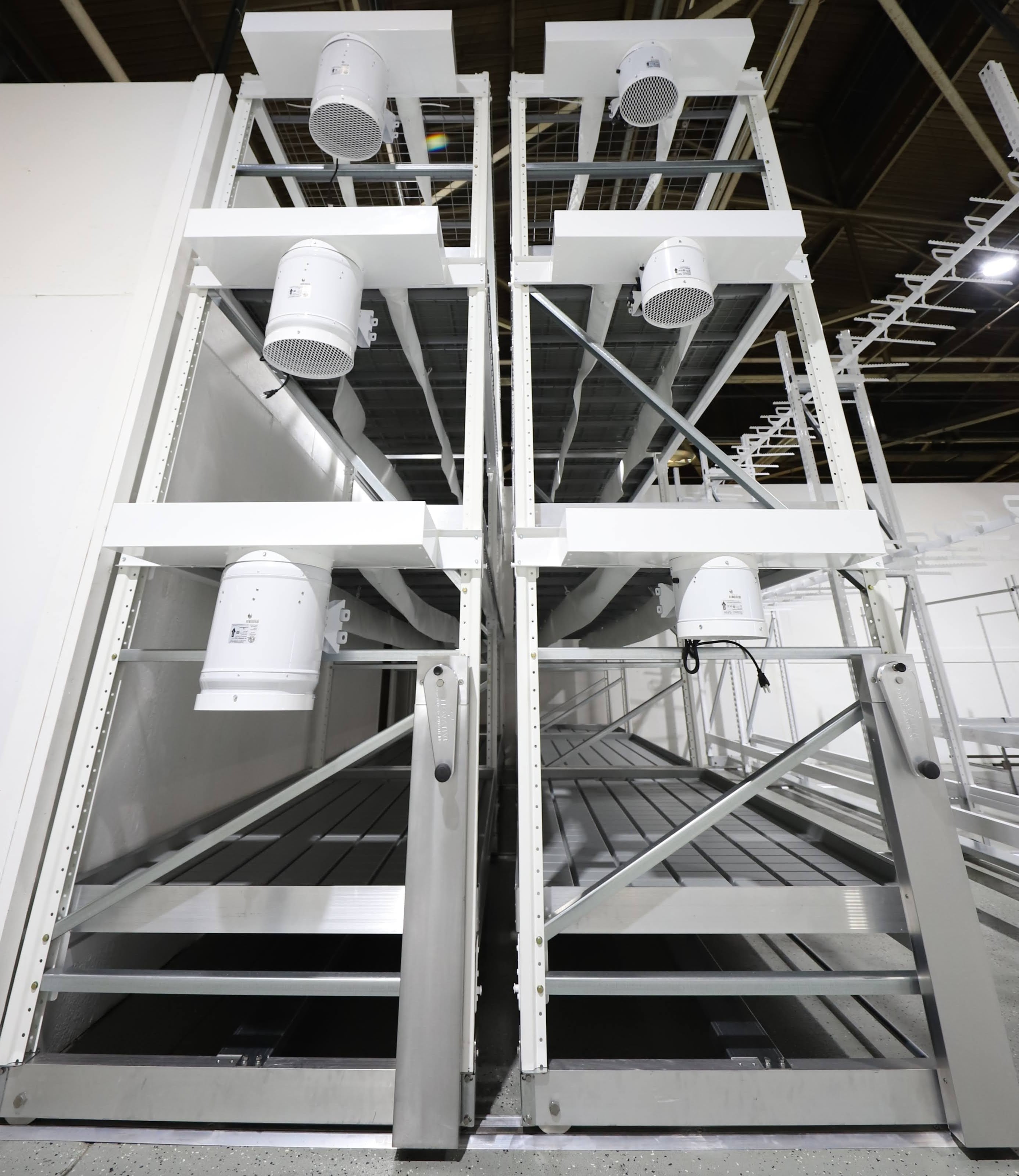 mobile vertical grow rack with airflow fans for controlled indoor plant cultivation