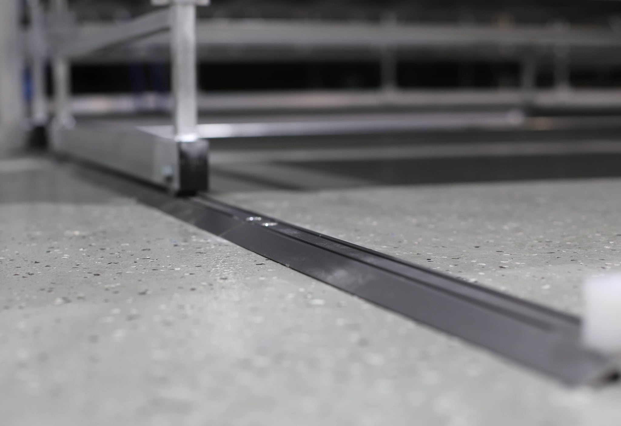 Track mounted rolling bench provides guided platform movement for storage and staging