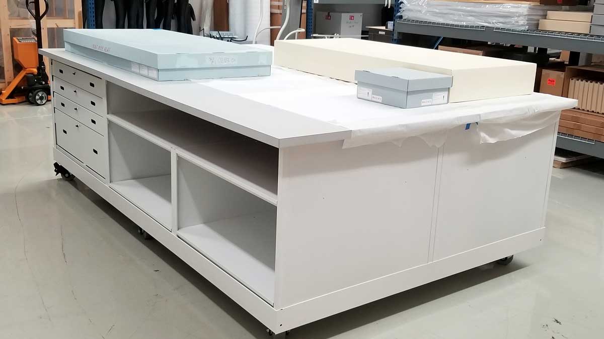 storage work table with open shelving and drawers for organizing art materials and supplies