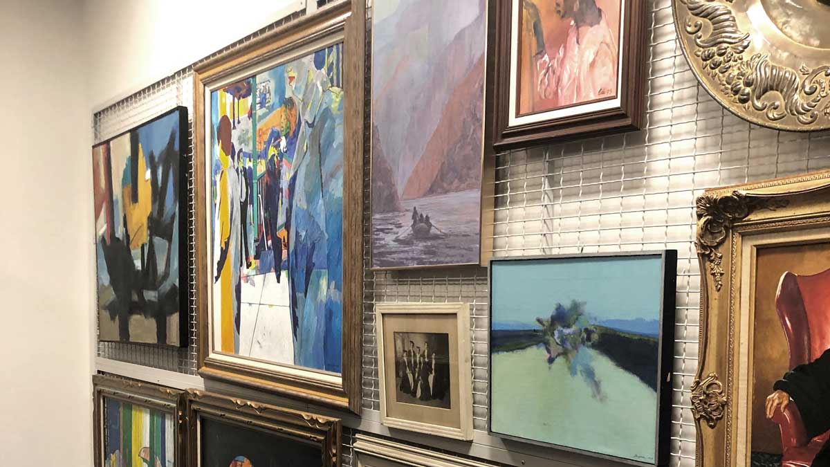 Wall-mounted storage panels for displaying and organizing framed artwork in a museum collection