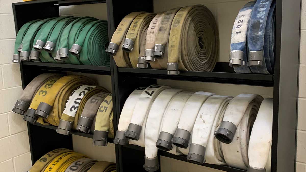 Firehose shelving rack for organized firehose storage and easy access