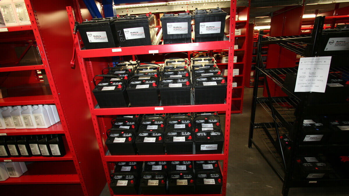 battery shelving storing automotive batteries for efficient inventory control and workspace safety