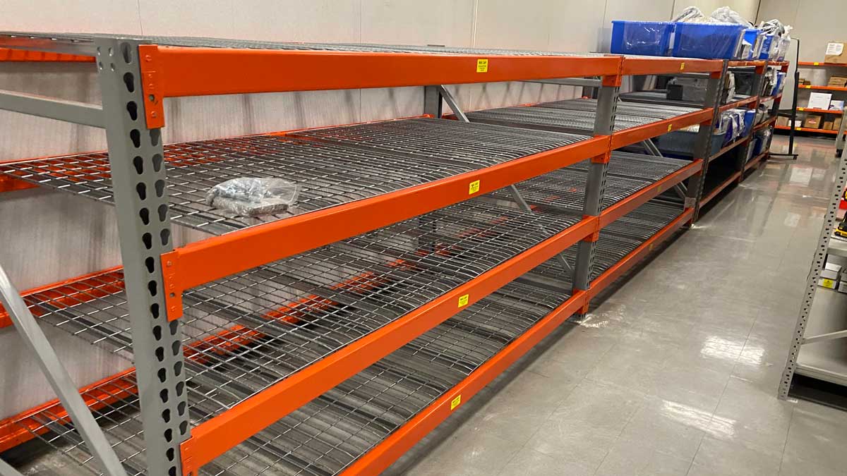 orange heavy duty shelving with wire decking for baggage handling optimization at port