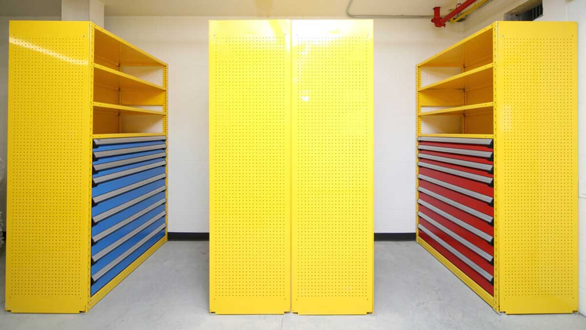 yellow wide span shelving with blue and red drawers for tool organization
