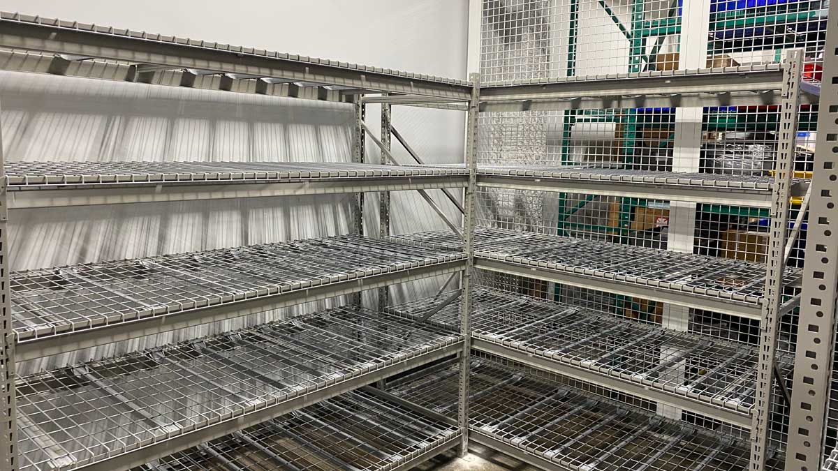 wire mesh corner shelving unit for industrial storage in warehouse