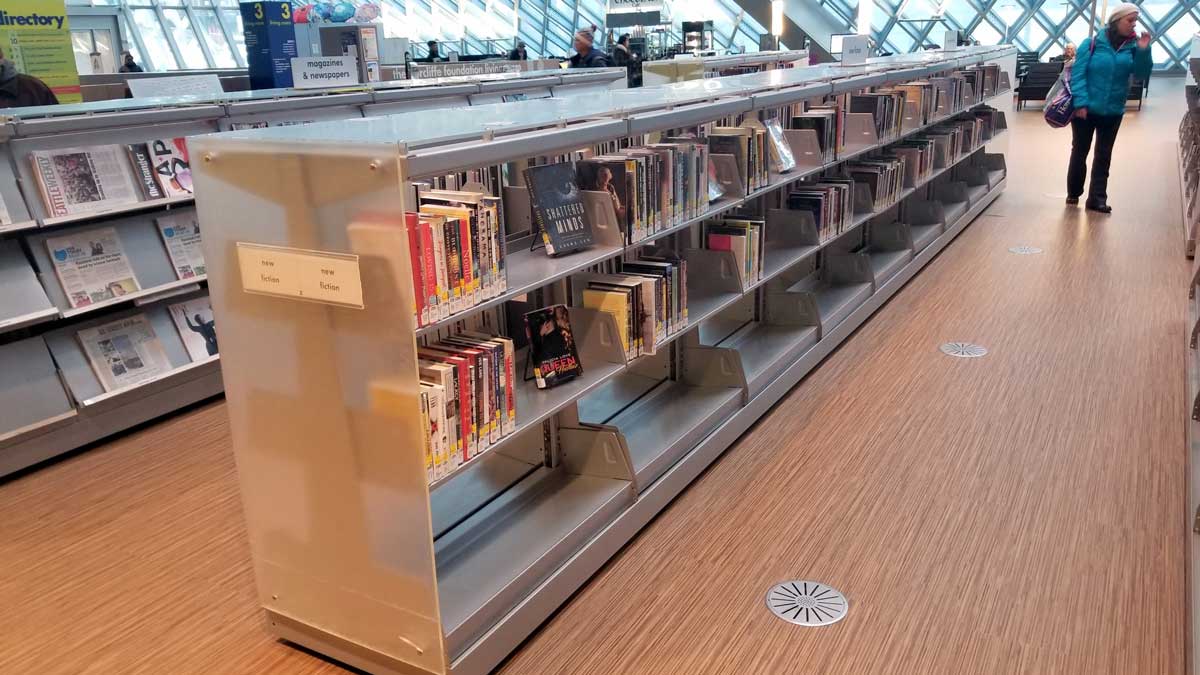 Compact library shelving units for efficient storage in tight spaces